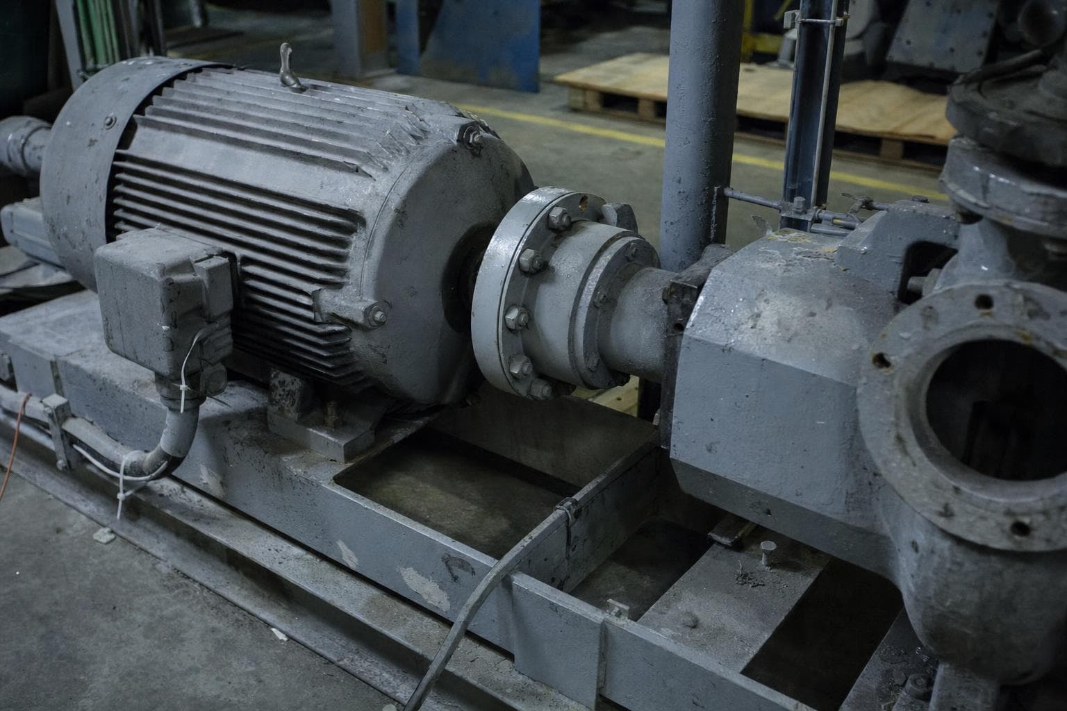 Electric motor coupled directly to an industrial pump